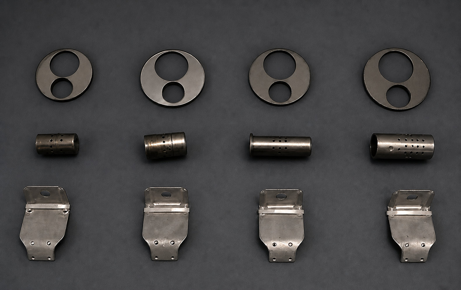 Twelve KSWV stamped and formed components arranged on a neutral surface